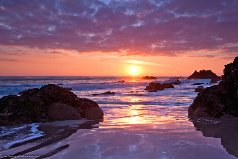 Sunset over rocky beach