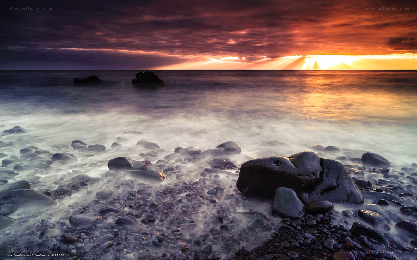 Sunset over rocky beach