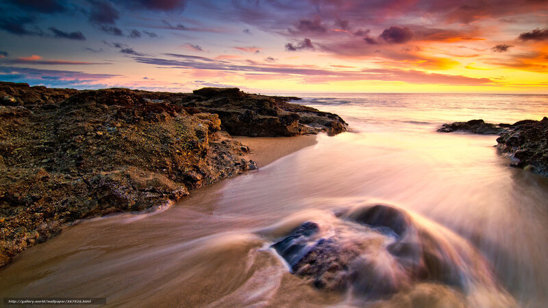 Sunset over rocky beach