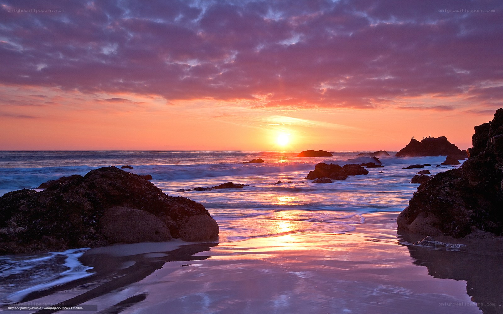 Sunset over rocky beach