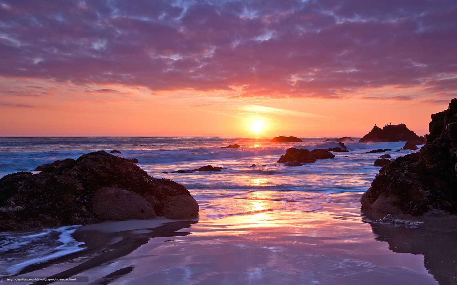 Sunset over rocky beach