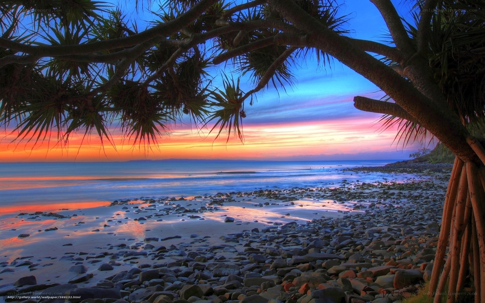 Sunset over rocky beach