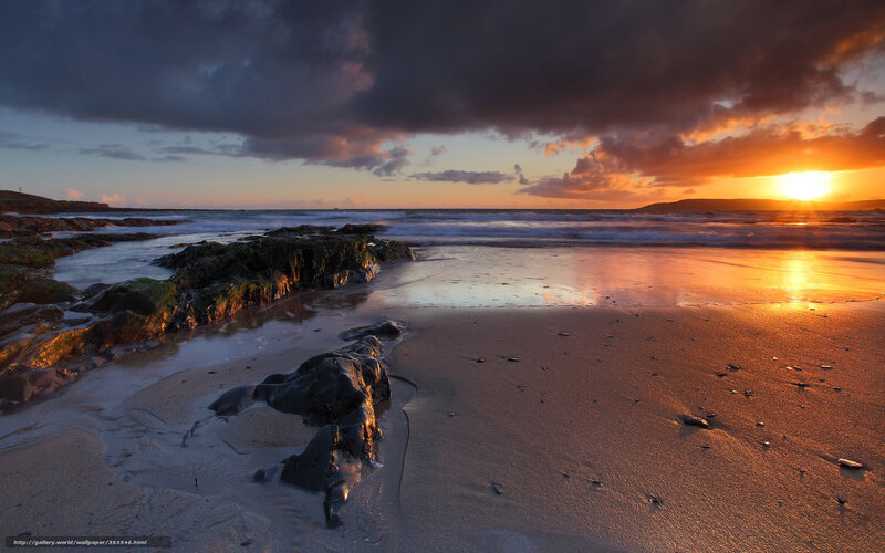 Sunset over rocky beach