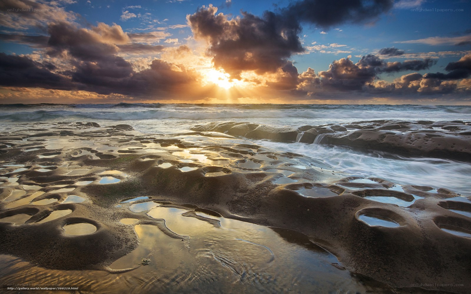 Sunset over rocky beach
