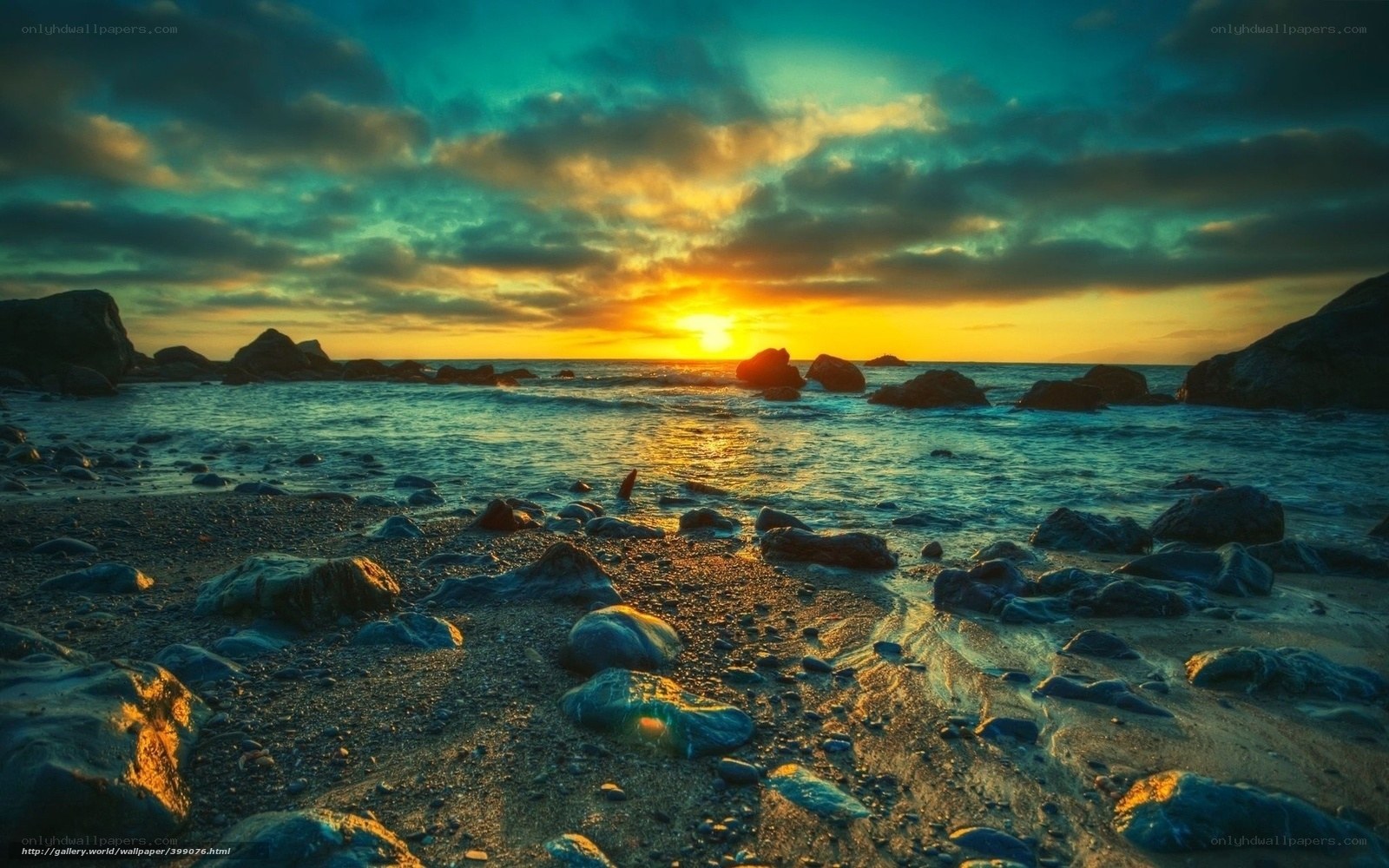 Sunset over rocky beach