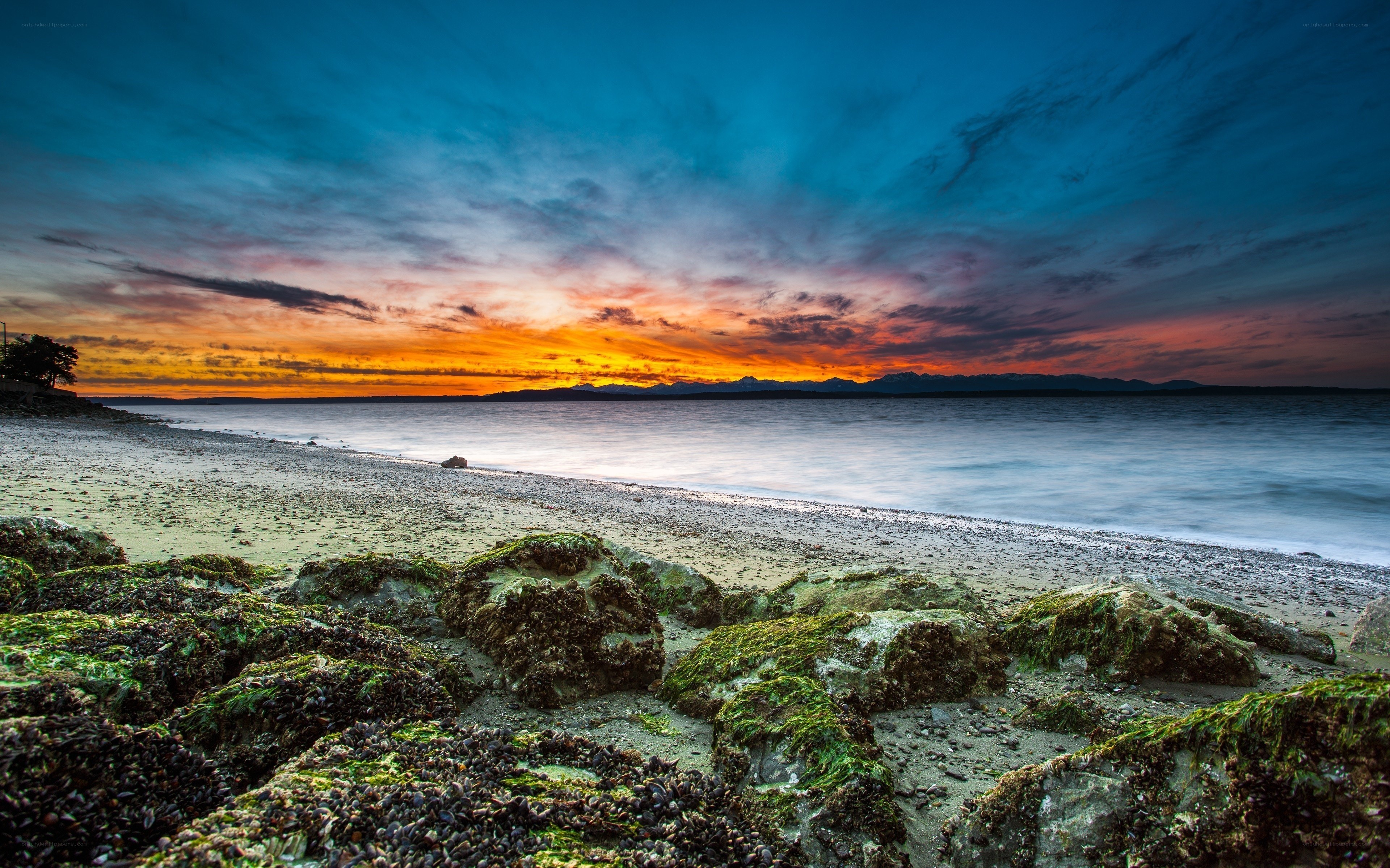 Sunset over rocky beach