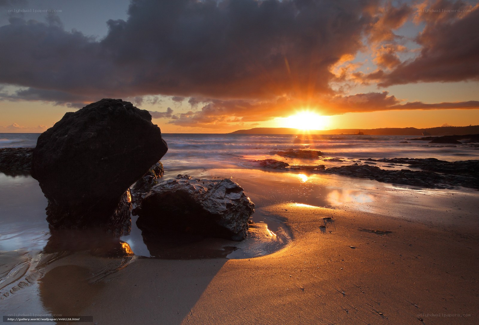 Sunset over rocky beach