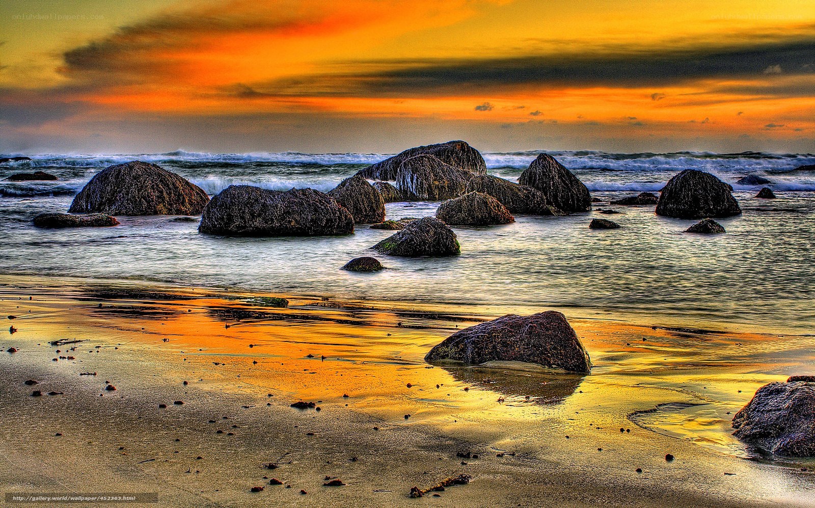 Sunset over rocky beach
