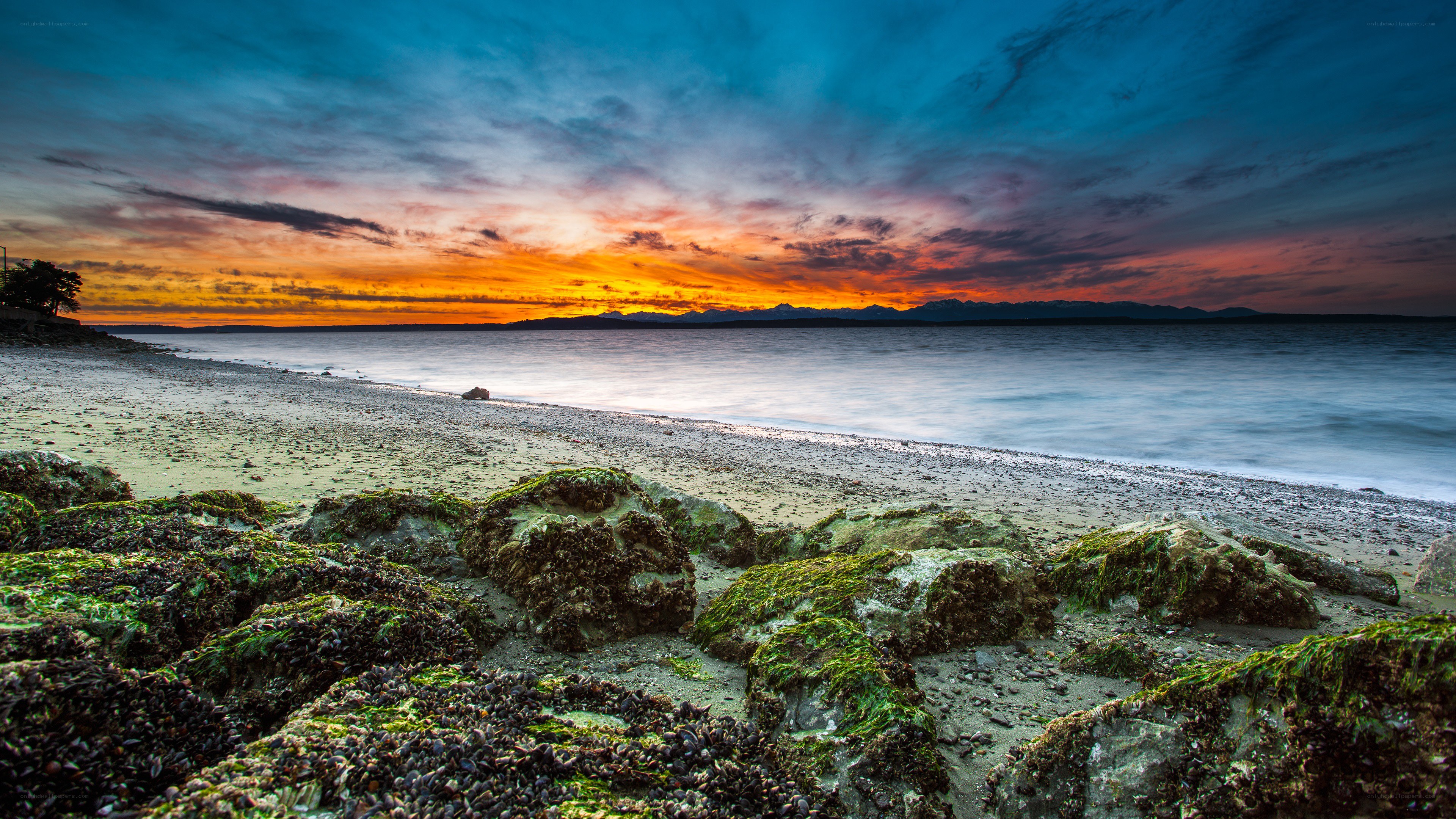 Sunset over rocky beach