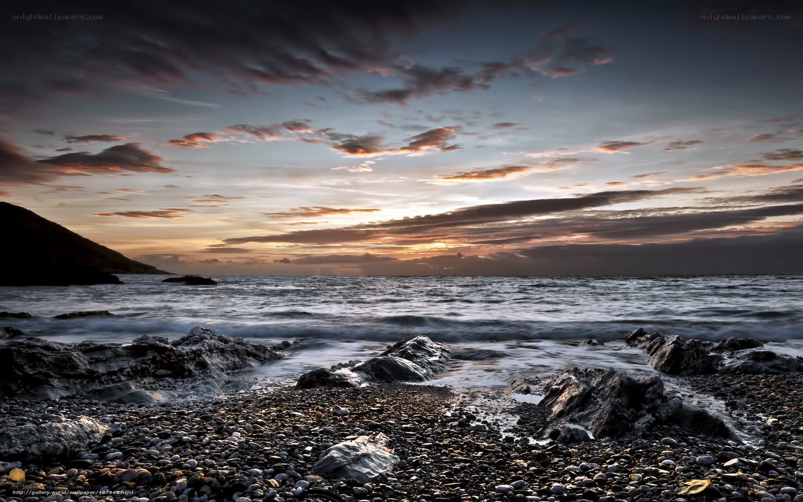 Sunset over rocky beach