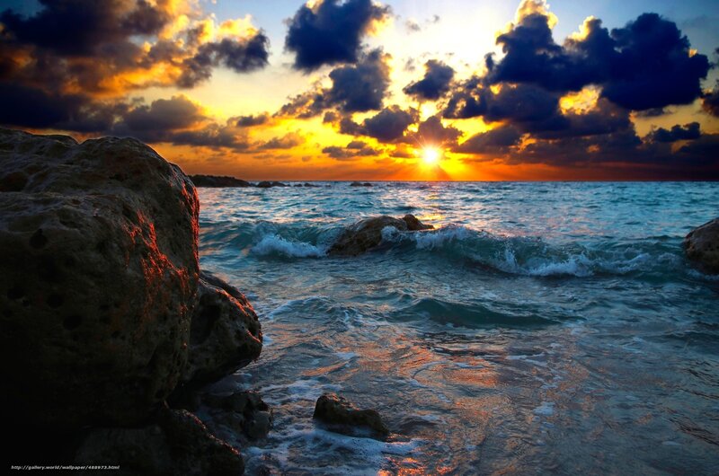 Sunset over rocky beach
