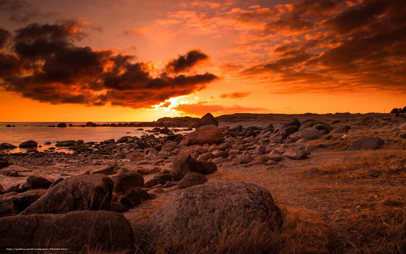 Sunset over rocky beach