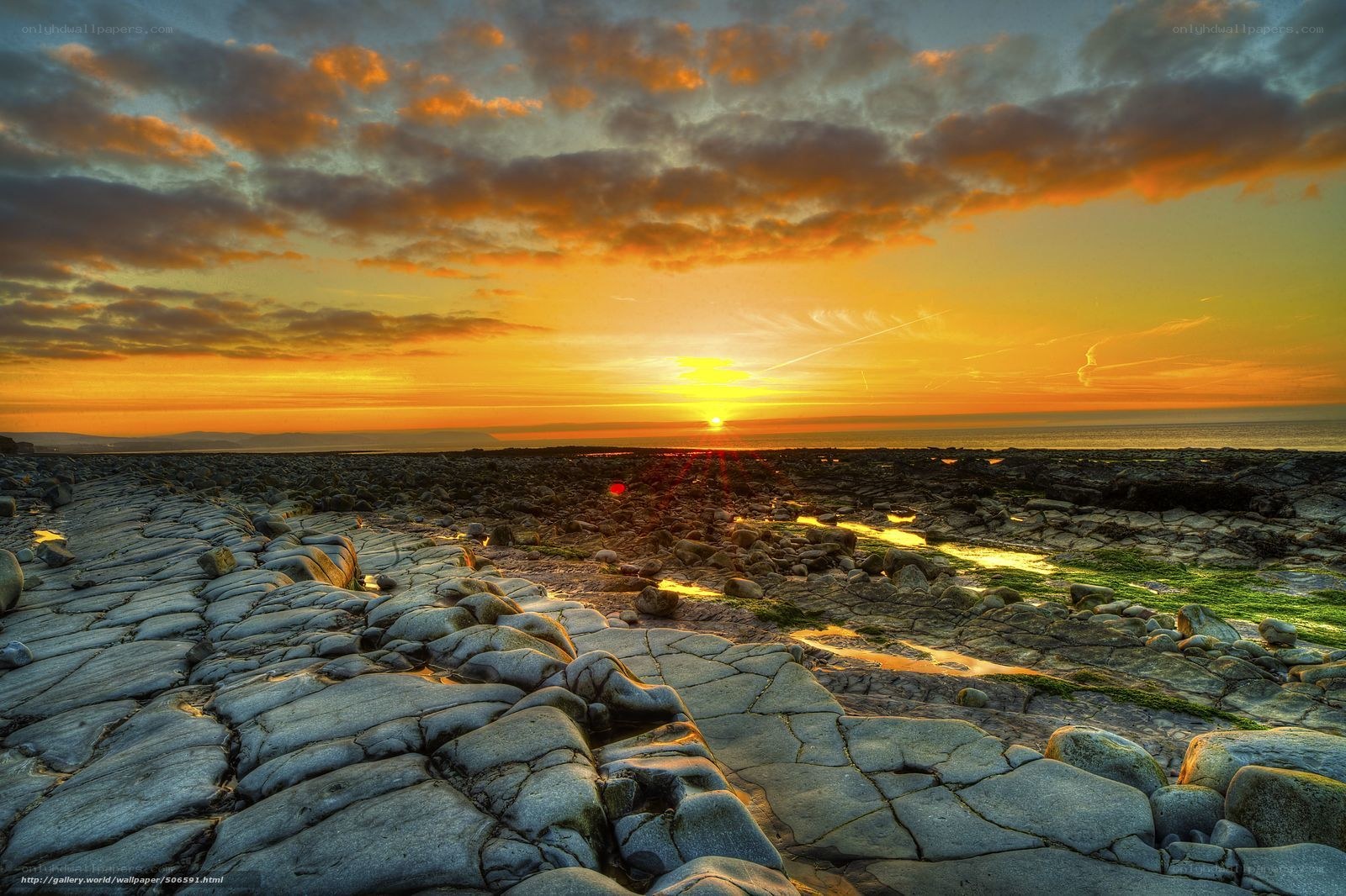 Sunset over rocky beach