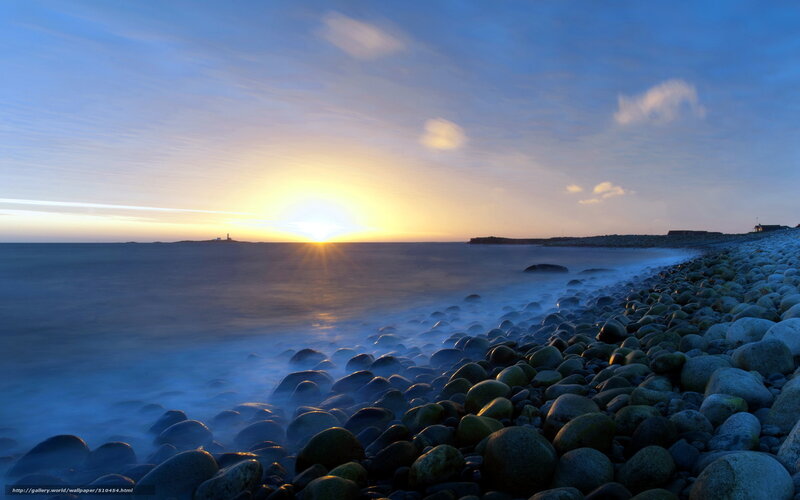 Sunset over rocky beach