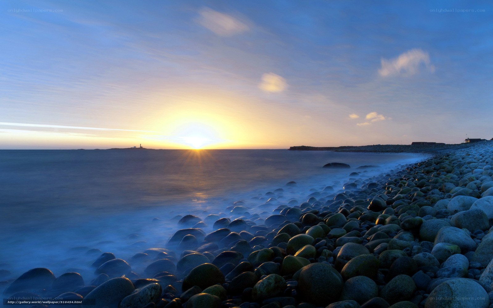 Sunset over rocky beach