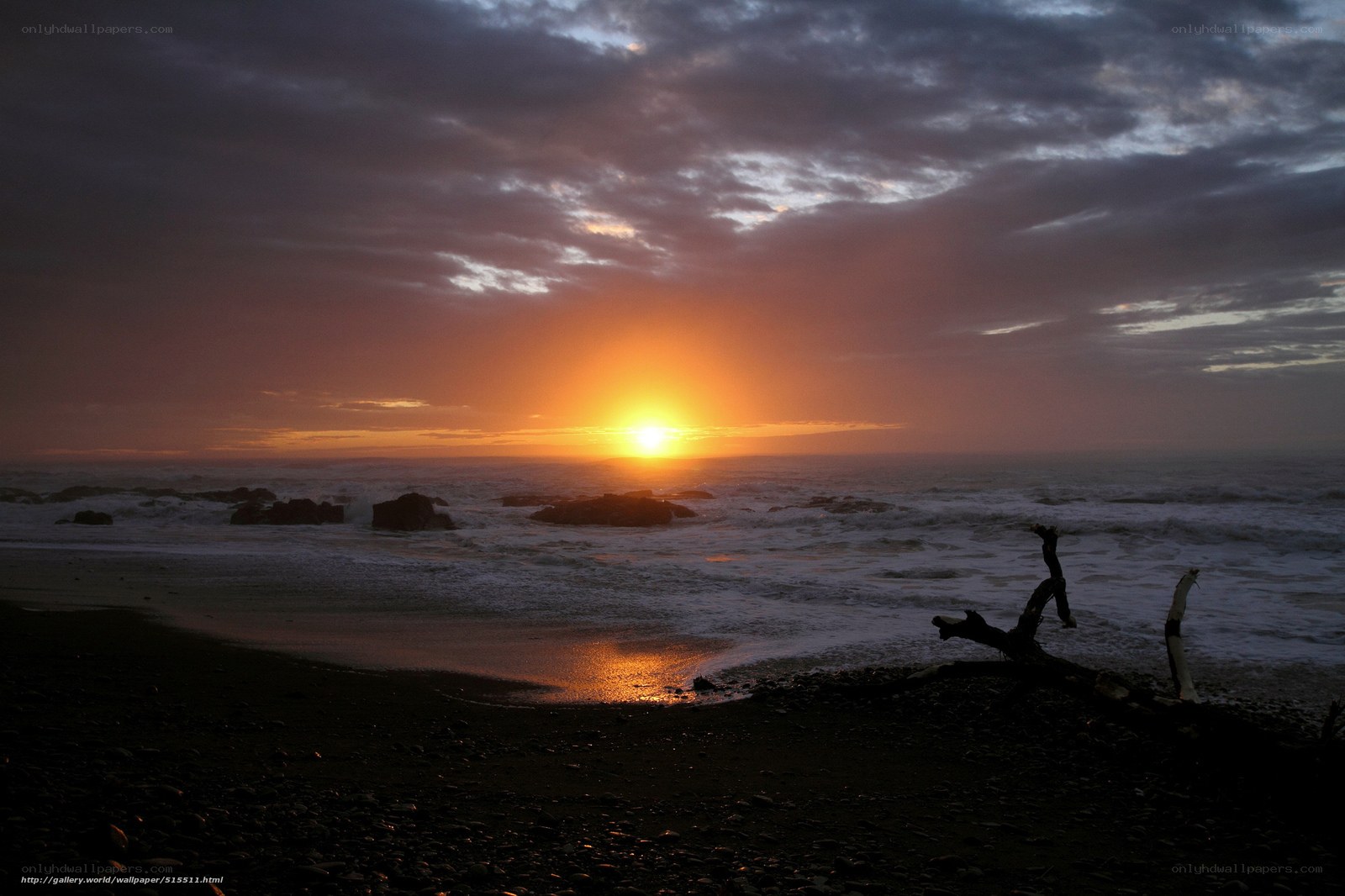 Sunset over rocky beach