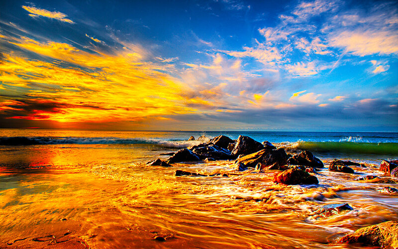 Sunset over Rocky Beach — Blue, Dramatic, Photograph, Rocks, Ocean, Sky, Yellow