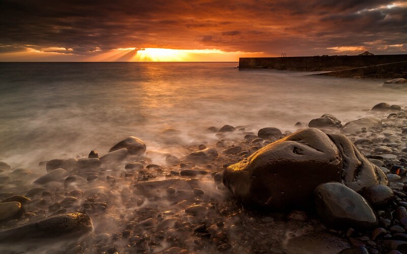 Sunset over Rocky Beach — Orange, Dramatic, Photograph, Ocean, Pier