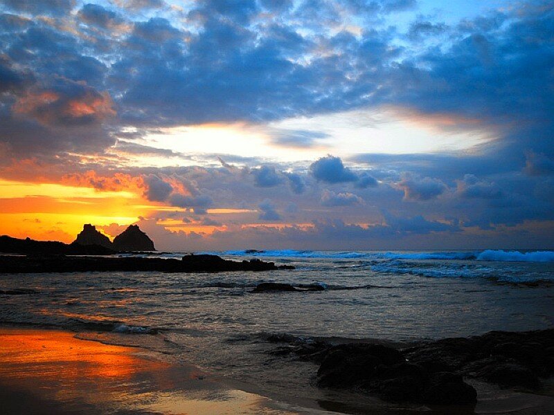 Sunset over Rocky Beach — Orange, Dramatic, Photograph, Rocks, Ocean, Clouds, Blue