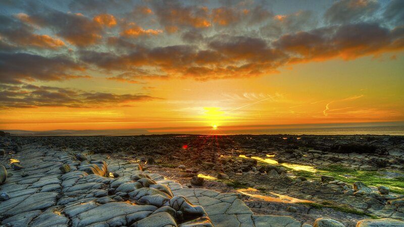 Sunset over Rocky Beach — Orange, Dramatic, Photograph, Sky