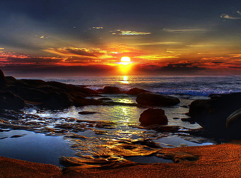 Sunset over Rocky Beach — Orange, Dramatic, Photograph