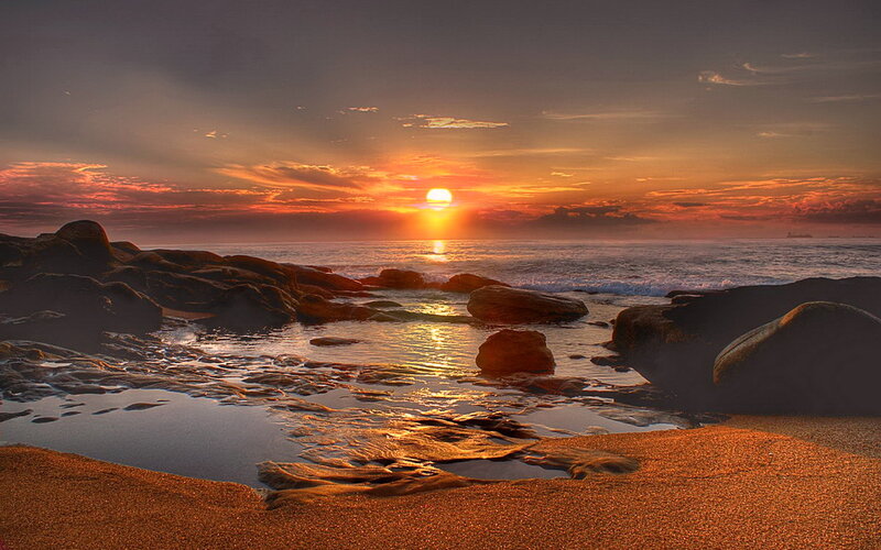 Sunset over Rocky Beach — Orange, Serene, Photograph, Ocean, Rocks, Sand
