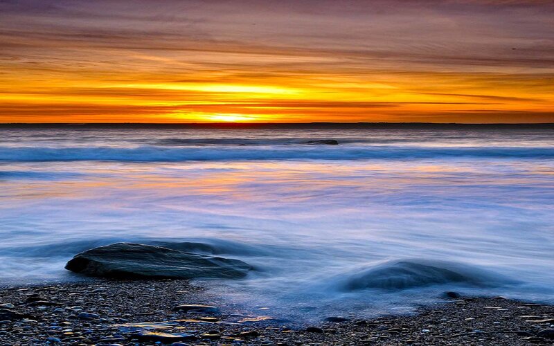 Sunset over Rocky Beach — Orange, Serene, Photograph, Ocean, Sky, Rocks, Blue