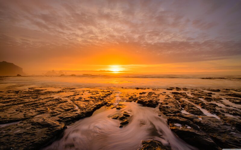 Sunset over Rocky Beach — Orange, Serene, Photograph, Ocean, Sky