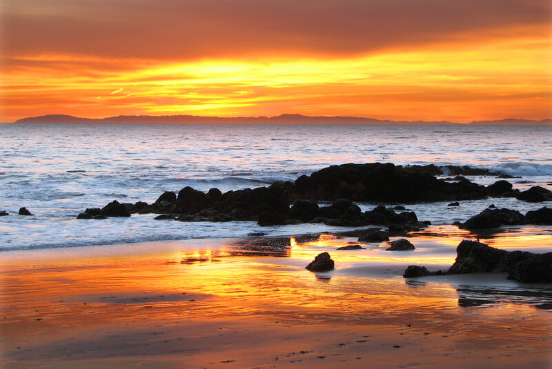Sunset over Rocky Beach — Orange, Serene, Photograph, Ocean