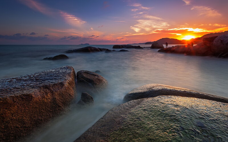 Sunset over Rocky Beach — Orange, Serene, Photograph, Rocks, Ocean, Sky, Silhouette