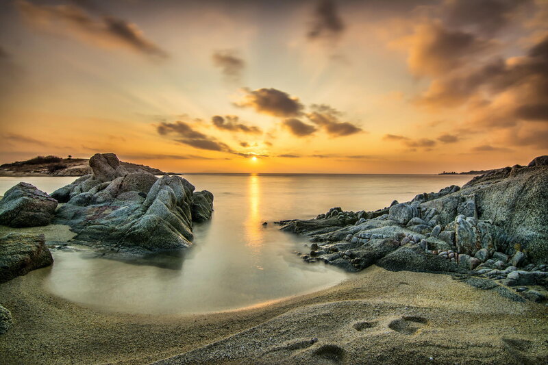 Sunset over Rocky Beach — Orange, Serene, Photograph, Rocks, Sand, Sea