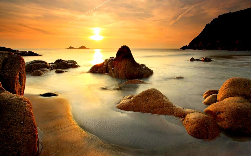 Sunset over Rocky Beach — Orange, Serene, Photograph, Rocks, Sea