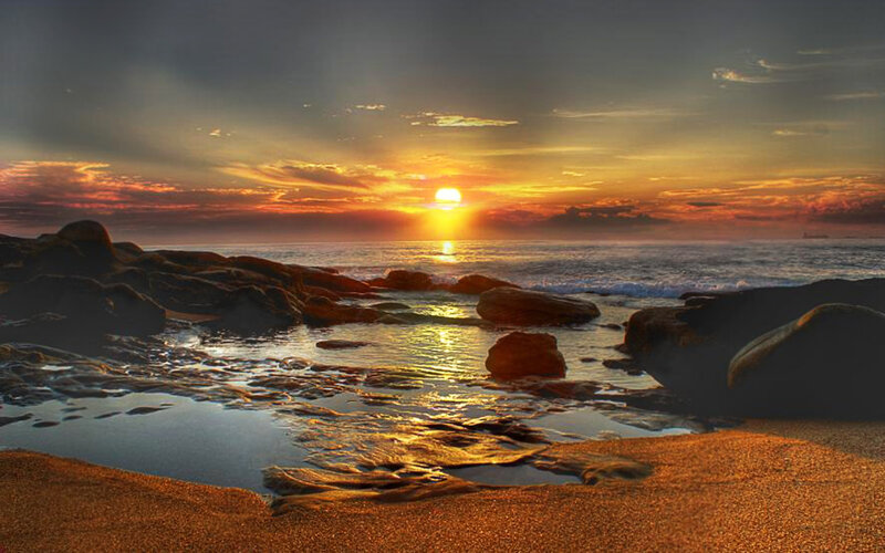 Sunset over Rocky Beach — Orange, Serene, Photograph