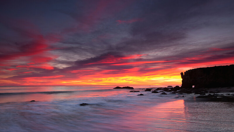 Sunset over Rocky Beach — Red, Dramatic, Photograph, Ocean