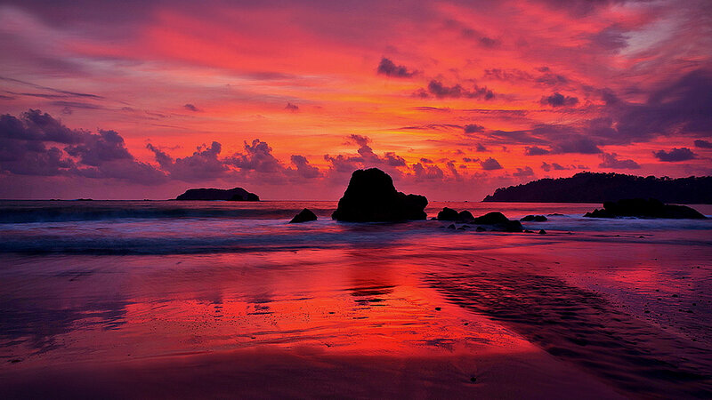 Sunset over Rocky Beach — Red, Dramatic