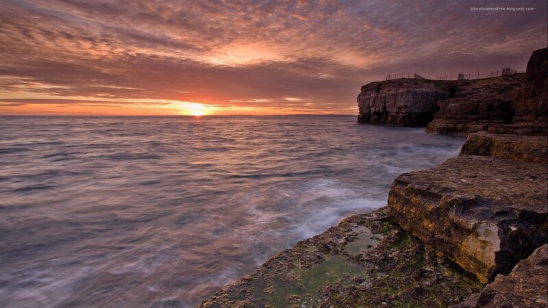 Sunset over rocky cliffs