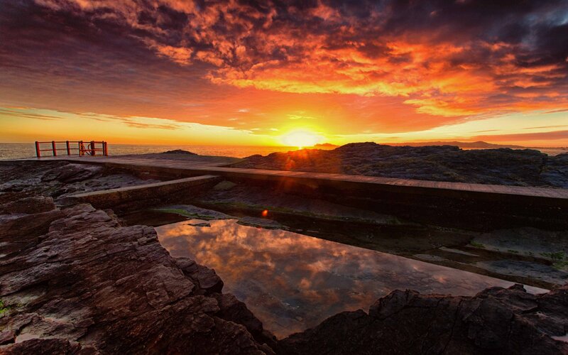Sunset over rocky coast