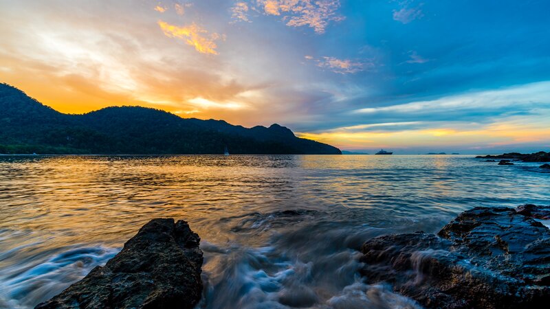 Sunset over Rocky Coast — Blue, Serene, Photograph, Mountains