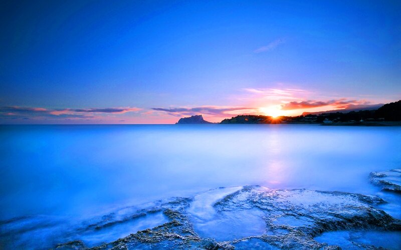 Sunset over Rocky Coast — Blue, Serene, Photograph, Sun
