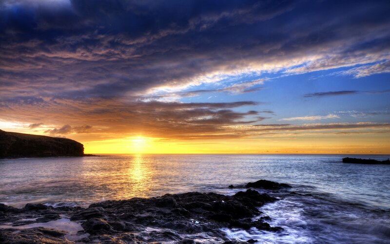 Sunset over Rocky Coast — Blue
