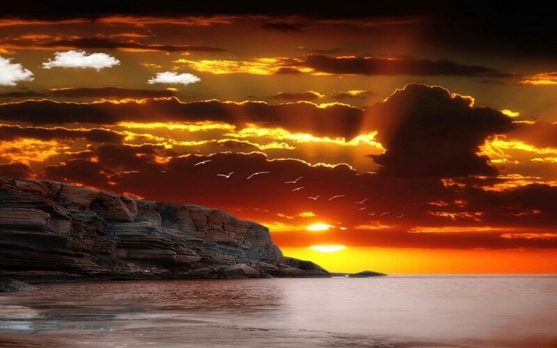 Sunset over Rocky Coast — Orange, Dramatic, Photograph