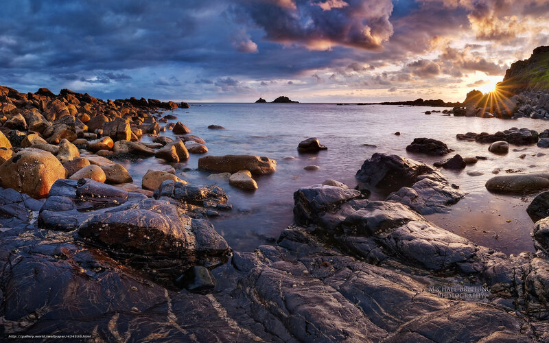 Sunset over rocky coastline