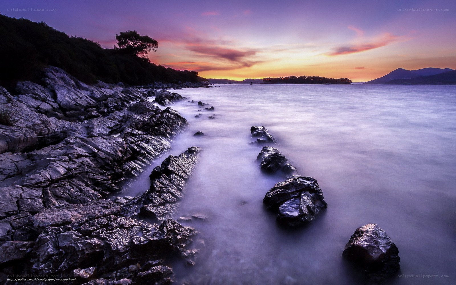 Sunset over rocky coastline
