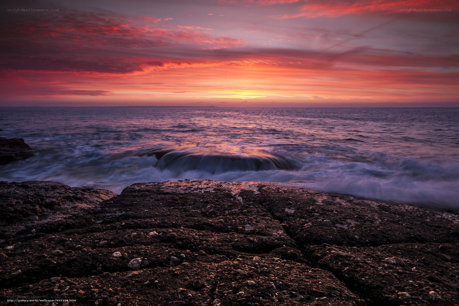Sunset over rocky coastline