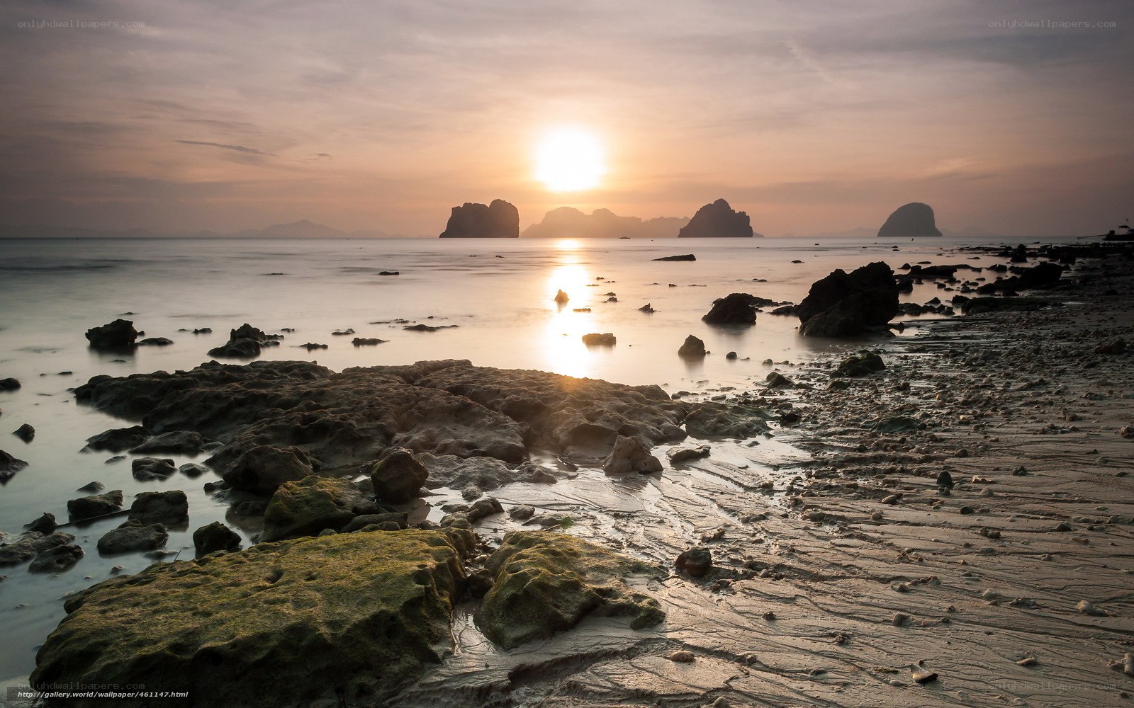 Sunset over rocky coastline