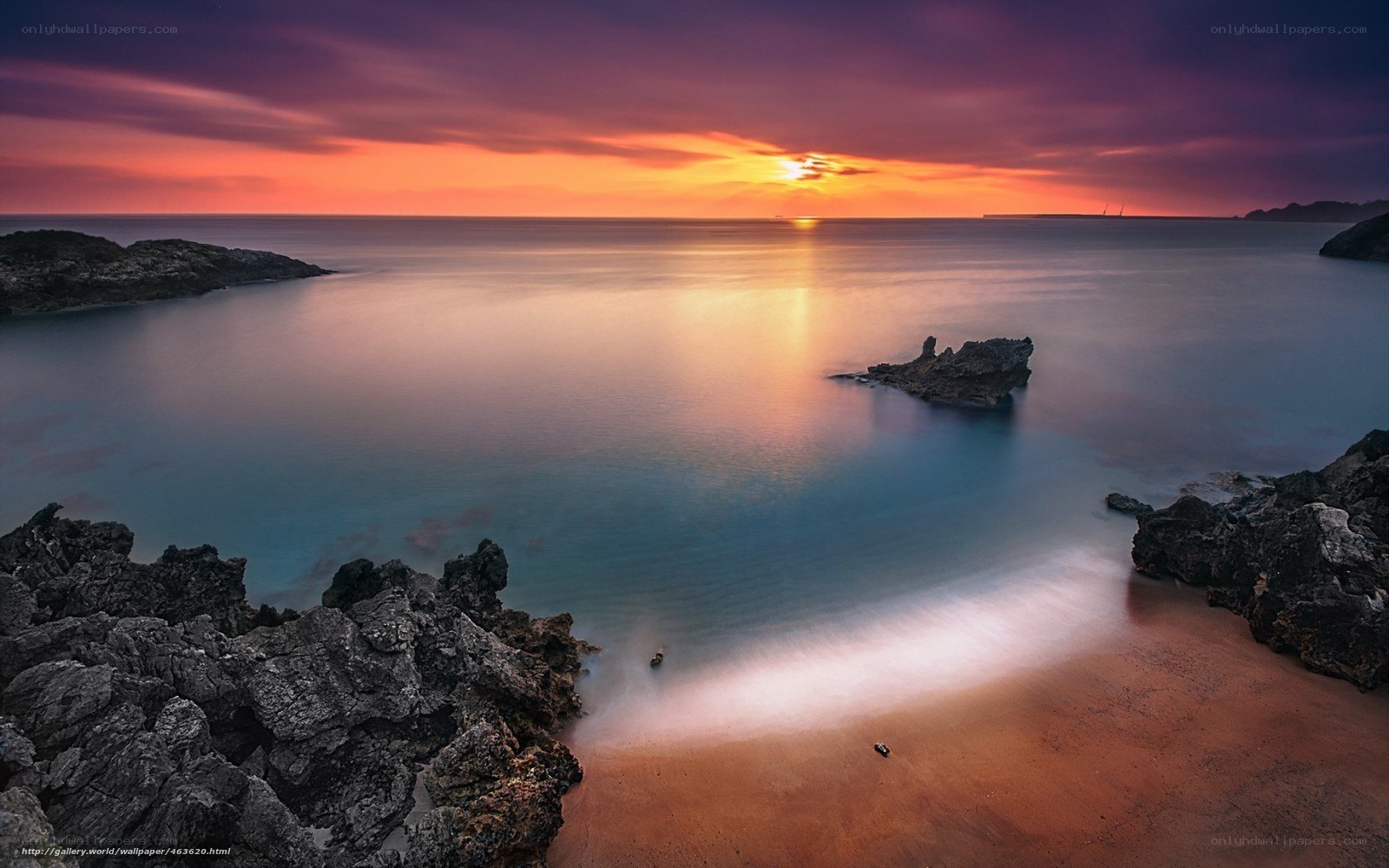 Sunset over rocky coastline