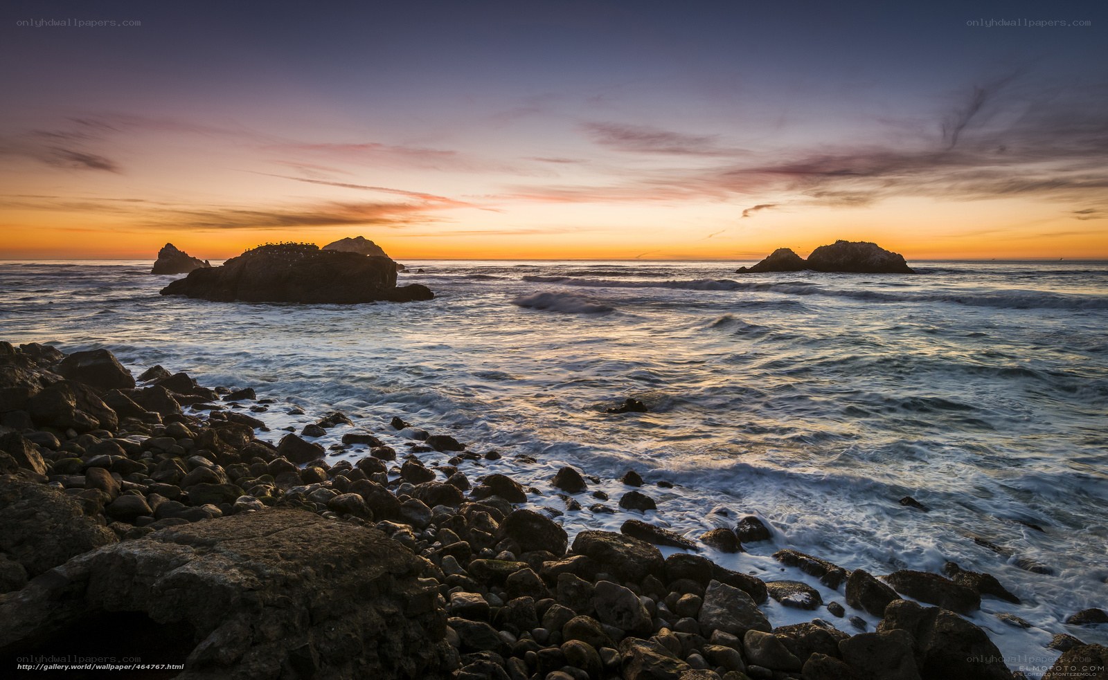 Sunset over rocky coastline