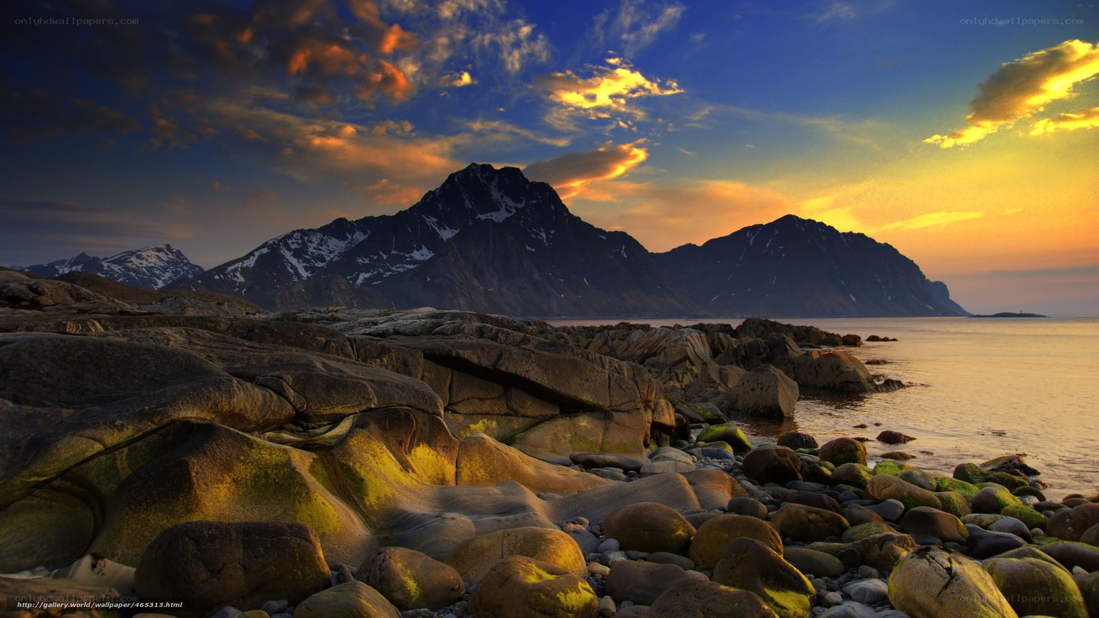 Sunset over rocky coastline