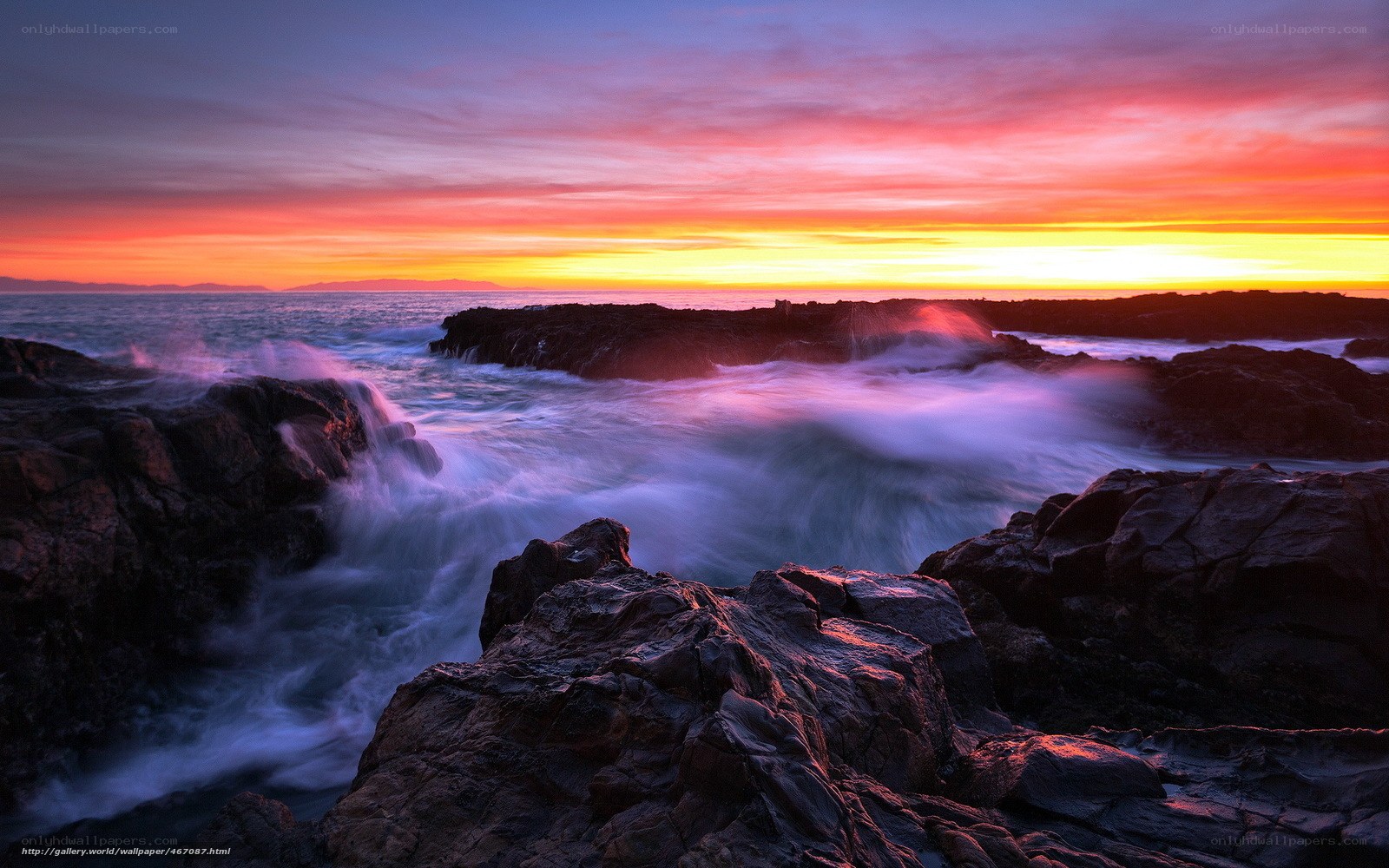 Sunset over rocky coastline