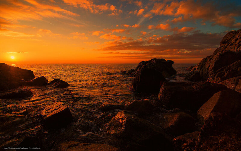 Sunset over rocky coastline